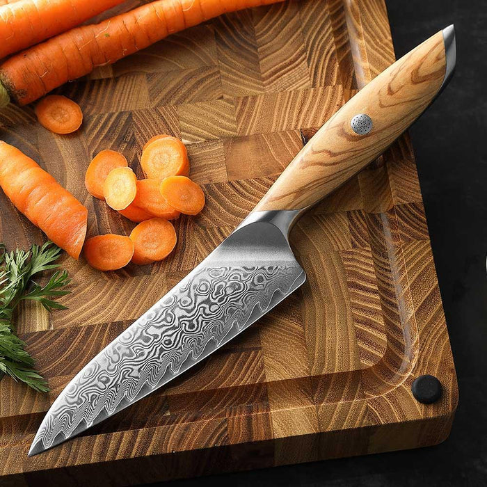 Damascus Utility Knife on cutting board